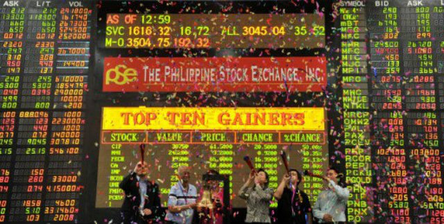 MORE LISTING. More firms are expected to list with the PSE in 2014. Photo by AFP.