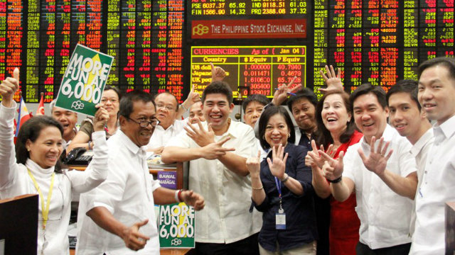 MORE FUN AT 6,000. Traders celebrate the stock market's continued rally to all-time highs. Photo courtesy of the Philippine Stock Exchange
