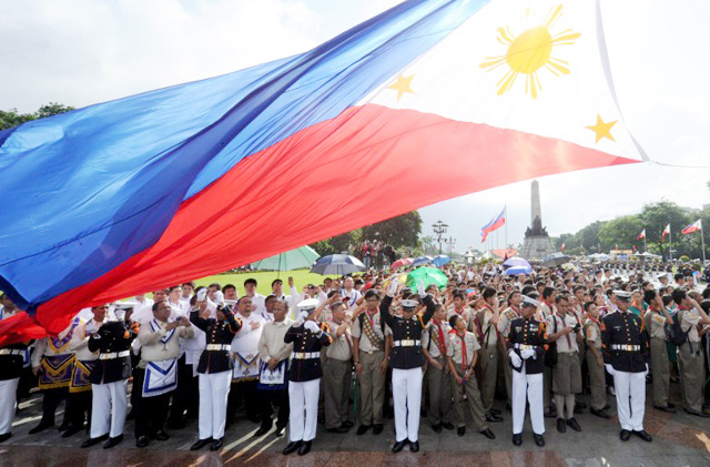 Philippine Marines raise the country's flag of the nation's 114th Independence Day celebrations in Manila on June 12, 2012. The Philippines declared independence from Spain in 1898, ending three centuries of Spanish rule. AFP PHOTO / Jay DIRECTO