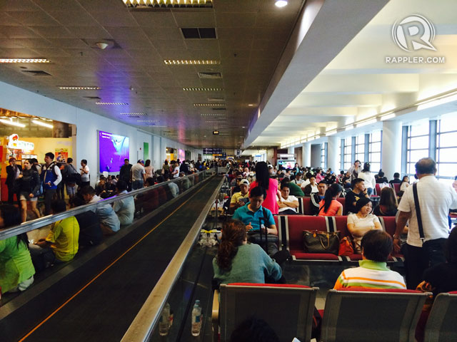 More than 20 flights have been cancelled in the Philippines on Friday, September 19. This photo shows passengers at the Ninoy Aquino International Airport Terminal 3. Photo by Amir Mawallil / Rappler.com