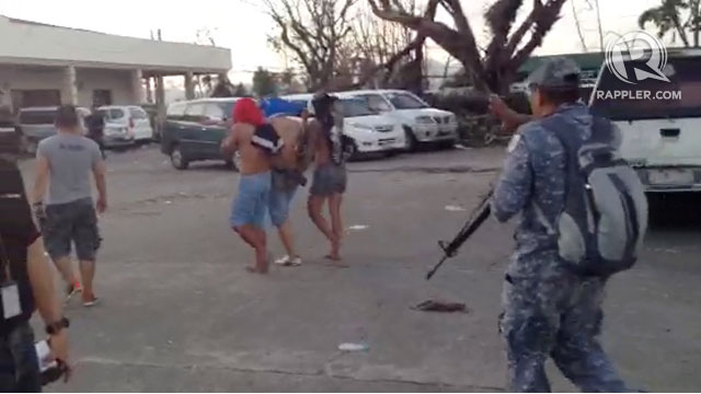 JAILBREAK? Soldiers escort captured prisoners who attempted to flee from the Tacloban city jail. Screngrab from a video taken by Rupert Ambil/Rappler