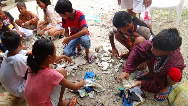 THE STORY OF TRASH. Campers imagine a story from items they gathered during beach cleanup.