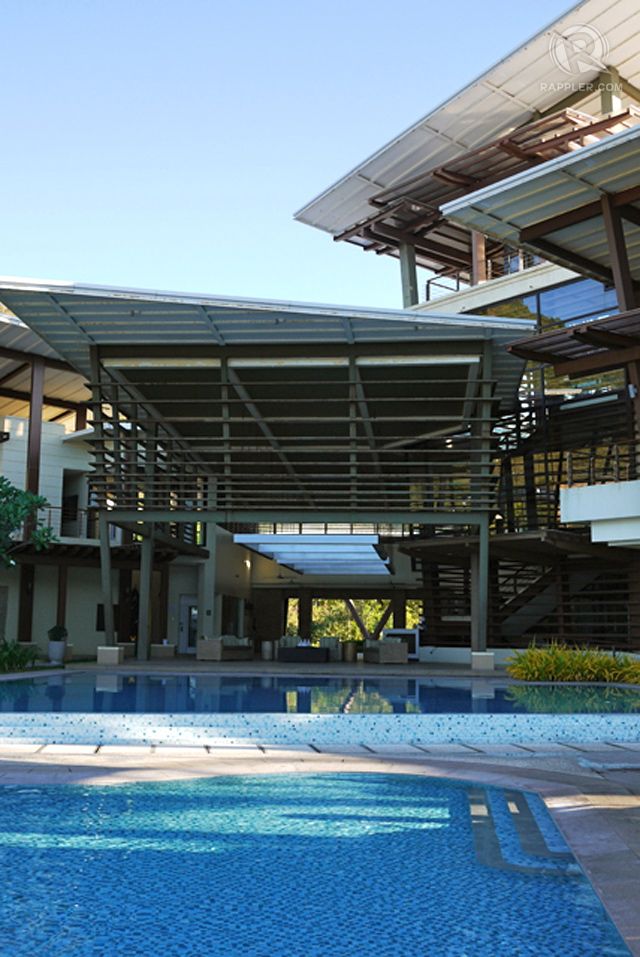Inside the country club with its beach-side pool