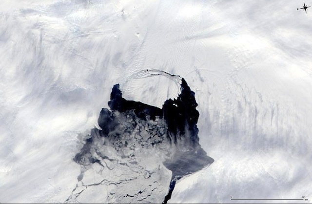 BREAKING UP. This MODIS image taken by NASA’s Aqua satellite on Nov. 10, 2013, shows an iceberg that was part of the Pine Island Glacier and is now separating from the Antarctica continent. Image courtesy NASA