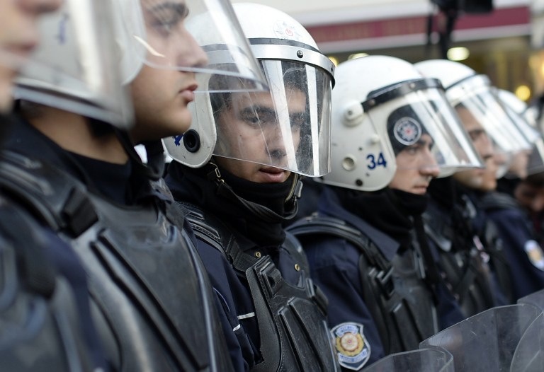 STANDING GUARD. Turkish riot policemen stand guard on Istiklal Avenue in Istanbul on January 5, 2014. Bulent Kilic/AFP