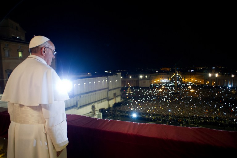 This handout picture released by the Vatican Press Office on March 13, 2013 shows Argentina's Jorge Bergoglio, elected Pope Francis I, appearing at the window of St Peter's Basilica's balcony after being elected the 266th pope of the Roman Catholic Church on March 13, 2013 at the Vatican. AFP PHOTO/OSSERVATORE ROMANO 