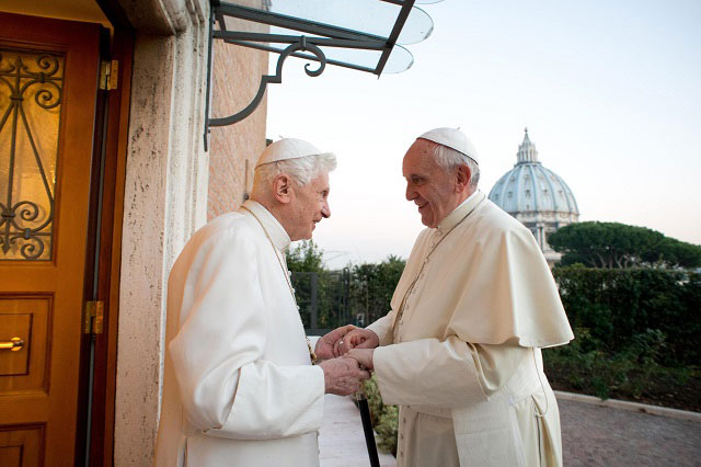 FIRST CHRISTMAS. A handout photo made provided by L'Osservatore Romano shows Pope Francis (R) being greeted by his predecessor Pope Emeritus Benedict XVI. Photo by L'OSSERVATORE ROMANO/EPA