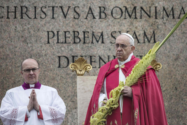 HOLY WEEK. Pope Francis holds a palm leaf as he leads a Mass in celebration of Palm Sunday in St Peter's Square, Vatican City, April 13, 2014. Palm Sunday for Roman Catholic devotees symbolically marks the biblical account of the entry of Jesus Christ into Jerusalem, signaling the start of the Holy Week before Easter. Photo by EPA/Angelo Carconi
