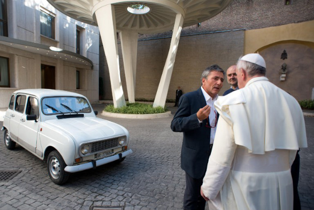'HUMBLE CAR.' This handout picture released by the Vatican Press Office on September 10 shows Pope Francis speaking with collaborators next to a white Renault 4L offered by Fr Don Renzo Zocca (unseen) on September 7 at the Vatican. File photo by Ossevatore Romano/AFP