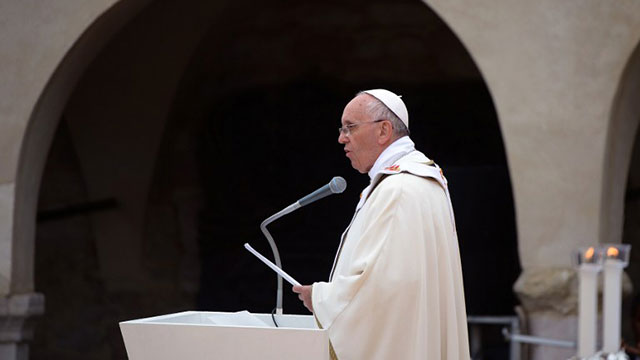 'DIVEST LIKE ST. FRANCIS'. Pope Francis leads a mass outside the St. Francis Basilica as part of his pastoral visit in Assisi on October 4, 2013. Pope Francis visited Assisi for the first time to honour the saint whose name he adopted. Photo by AFP / Filippo Monteforte