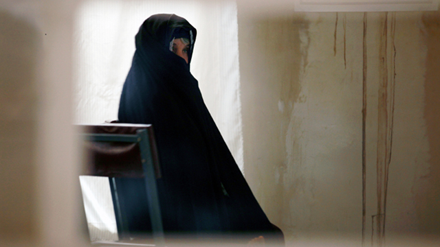 GLOBAL SCOURGE. A drug-addicted woman waits to undergo blood tests at a drop-in center supported by the UN in Herat, Afghanistan. Photo from UN Multimedia