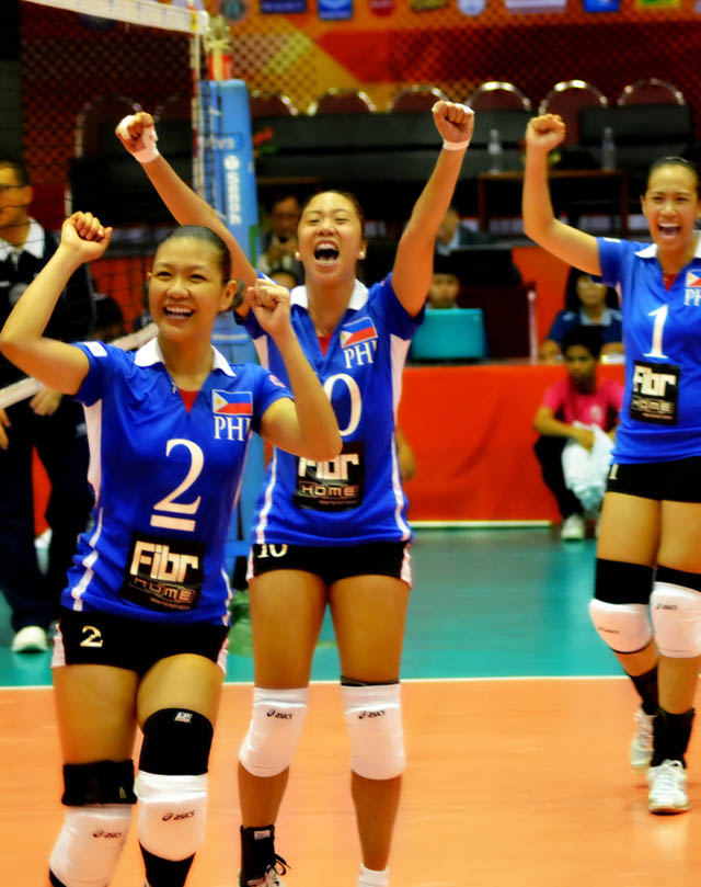 POWER PINAYS. PH spikers celebrate a point. Photo by Bianca Frost.