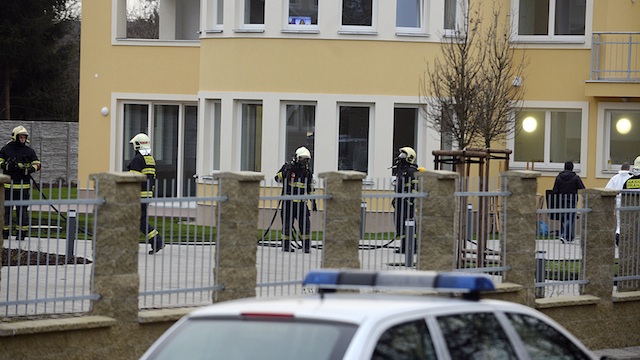 BLAST SCENE. Police and firefighters at the scene of a blast at the residence of Palestine ambassador, Jamal al-Jamal, in Prague, Czech Republic, 01 January 2014. Filip Singer/EPA