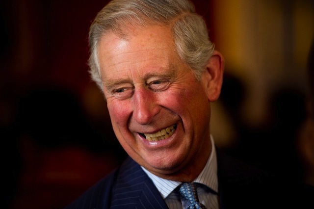 TURNING 65. Britain's Prince Charles reacts to a comment as he meets guests during a reception in Clarence House, central London on October 24, 2013. AFP / Pool / Leon Neal