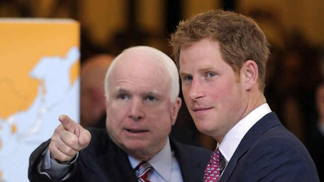 A PRINCE IN WASHINGTON. Britain's Prince Harry (R) is accompanied by US Senator John McCain as he tours a Senate photo exhibit on landmines and unexploded ordnances in the Rotunda of Russell Senate Office Building in Washington, DC, on May 9, 2013. Prince Harry is in the US on a week long visit. AFP PHOTO/Jewel Samad