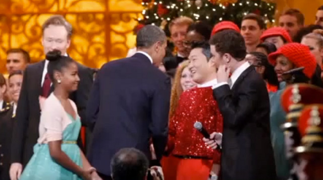 FORGIVEN? President Obama shakes Psy's hand after the Christmas special at the While House. Screen grab from YouTube