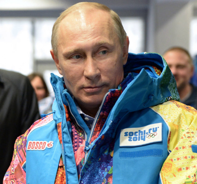 COLD FRONT. Russian President Vladimir Putin tries on a Sochi coat during his visit to the education center for volunteers for Sochi 2014 Olympic Games in Sochi, Russia. The Games are to take place from 07 to 23 February 2014. Photo by Alexey Nikolsky/EPA Ria Novosti/Kremlin