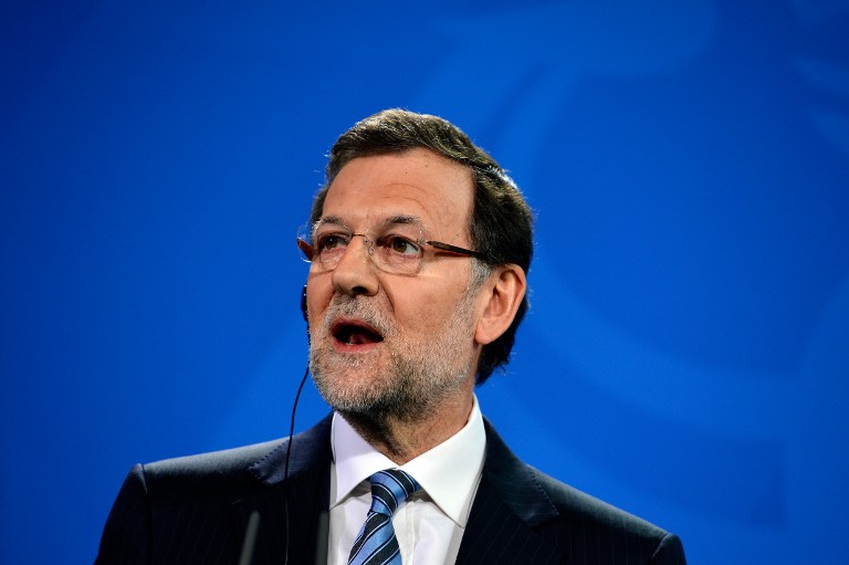 Spain's Prime Minister Mariano Rajoy addresses a press conference with the German Chancellor at the Chancellery in Berlin on February 4, 2013 after their meeting. AFP PHOTO / ODD ANDERSEN