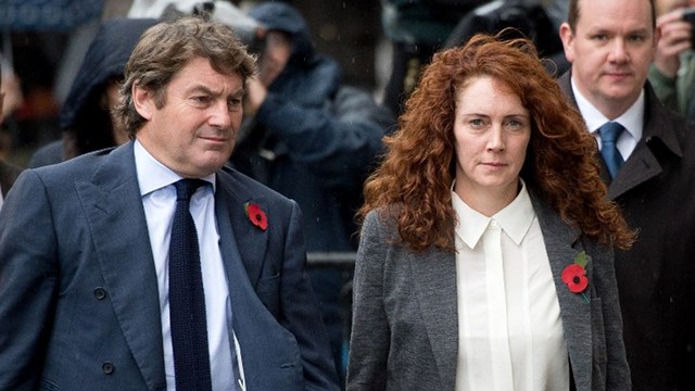 PHONE-HACKING SCANDAL. Rebekah Brooks, former News International chief executive, and her husband Charlie arrive for the phone-hacking trial at the Old Bailey court in London on October 31, 2013. Photo by Leon Neal/AFP 