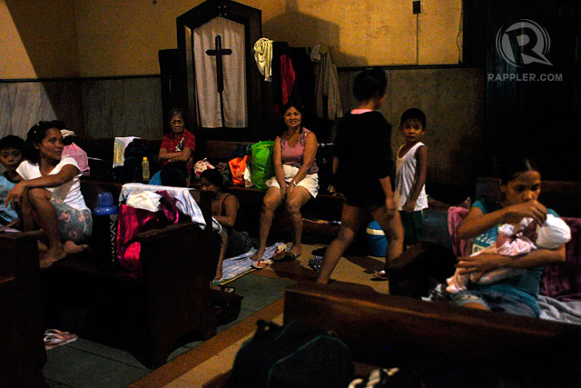 TEMPORARY SHELTER. Flood victims take refuge inside the Sto. Domingo church. Photo by Rappler