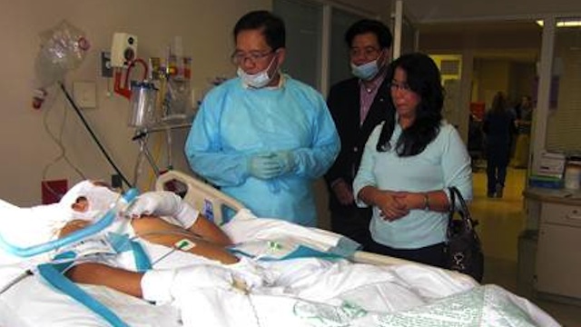 INJURED PINOYS RECOVERING WELL. Philippine Consul General in Chicago Leo Herrera-Lim (L) visits injured Filipino oil worker Renato Dominguez along with his wife in Baton Rouge, Louisiana. Photo courtesy of Philippine Embassy in Washington DC