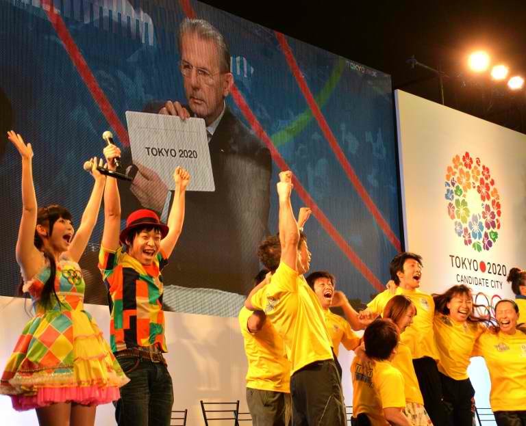 IT'S TOKYO! People celebrate as IOC President Jacques Rogge announces Tokyo for the 2020 Olympics host city on a screen at the live-viewing event in Tokyo on September 8, 2013. AFP / Yoshikazu Tsuno
