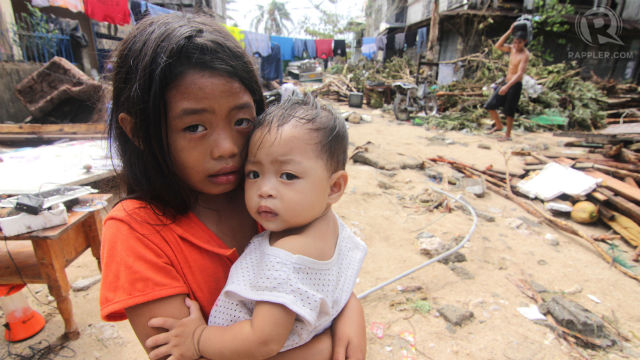 WHAT NEXT? Children stand in their devastated neighborhood in Balangkayan, Eastern Samar