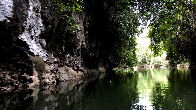 THE SCENERY DURING THE canoe ride is a balm to a body spent by caving