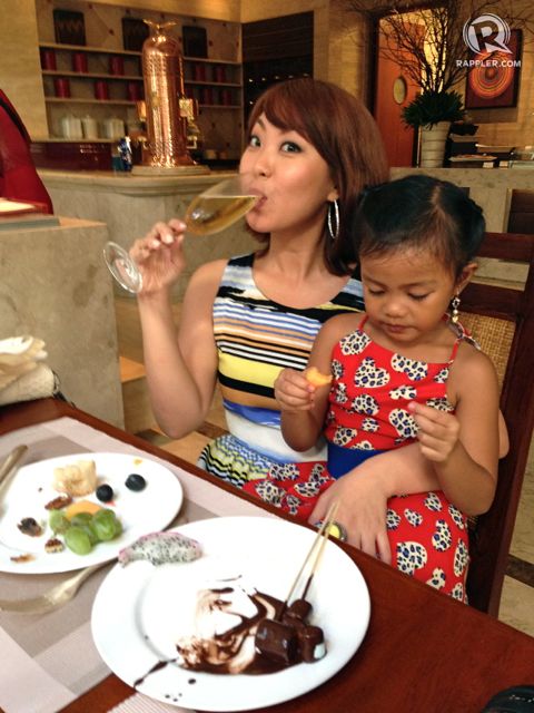 Sam enjoys food with goddaughter Asha