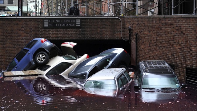 THOUSANDS HOMELESS. Cars piled on top of each other at the entrance to a garage on South Willliam Street in Lower Manhattan October 31, 2012 in New York as the city begins to clean up after Hurricane Sandy. AFP PHOTO/Stan HONDA