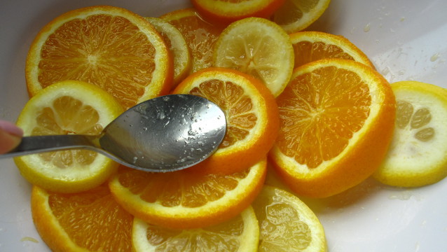 MUDDLING. Add sugar to the lemon and orange slices and mash with a spoon
