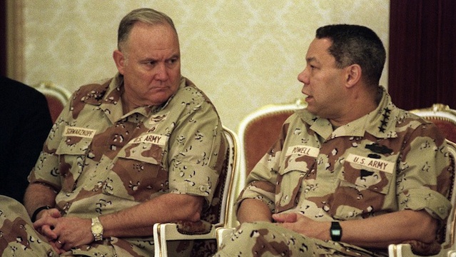 WAR HERO. This August 2, 1990 file photo shows US Army General Norman Schwarzkopf (L), Commander of the US Forces in Saudi Arabia, talking with US General Colin Powell (R), Chairman of the Joint Chiefs of Staff, in Dahran, Saudi Arabia. AFP PHOTO /Files / BOB SULLIVAN