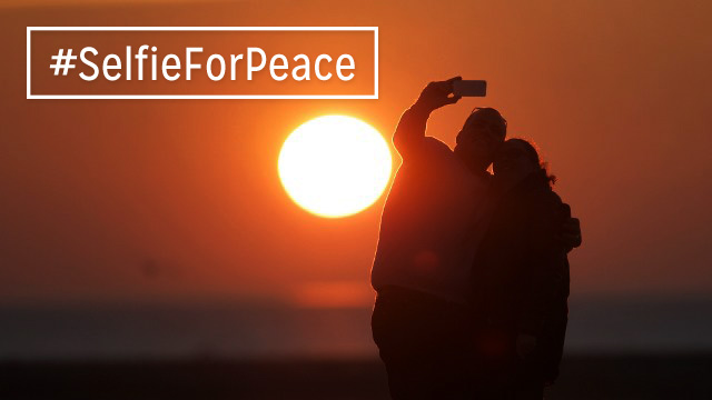 PEACE. Take a selfie for peace. Original photo from AFP