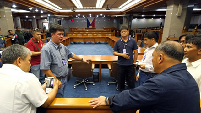 SEAT RESERVED. The Office of the Sergeant-at-Arms conducts and police conduct an ocular inspection of the Senate session hall ahead of Napoles' testimony. Photo by Joseph Vidal/Senate PRIB