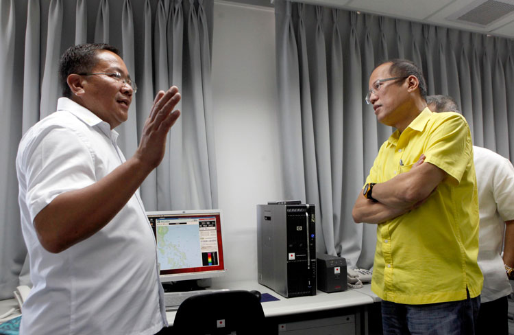 In this file photo, PAGASA Administrator Dr. Nathaniel Servando (L) gives President Benigno Aquino III a tour of the facilities of the PAGASA radar station in Bato, Catanduanes, during the station's inauguration May 2, 2012. Behind Aquino is Science Sec Mario Montejo. Photo courtesy of the Malacañang Photo Bureau