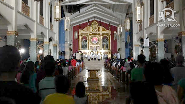 FEWER CHURCHGOERS. Residents of Tacloban City observe fewer people attended the first Simbang Gabi at the partially damaged Sto Nino Church. Photo by Voltaire Tupaz