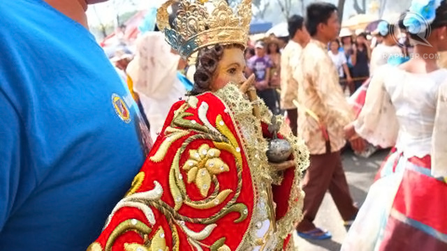 DEVOTEES of the Santo Nino bring their own image to the parade
