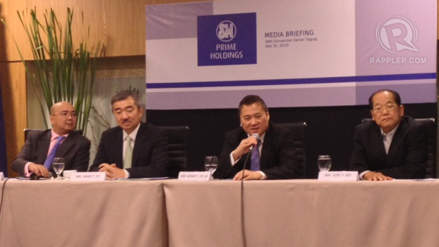 BIGGER TARGET. Sy-led SM Group wants to be a regional real estate powerhouse. Photo taken during the May 31 press briefing of SM Investments Corp with brothers Hans Sy (2nd from left) and Henry Jr. (3rd from left) by Lean Santos/Rappler