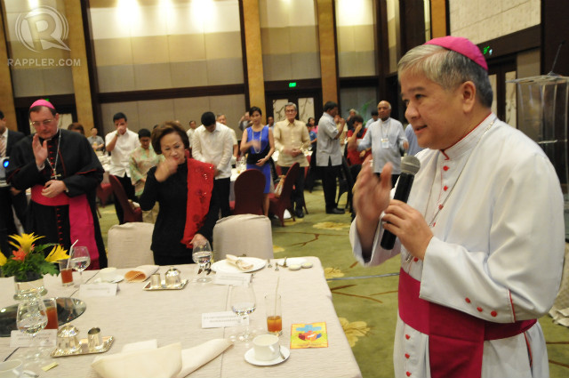 CATHOLIC LEADER. CBCP president Lingayen-Dagupan Archbishop Socrates Villegas blesses the crowd during a dinner on May 13, 2014 for the Asian Conference on the Family. Photo by Roy Lagarde