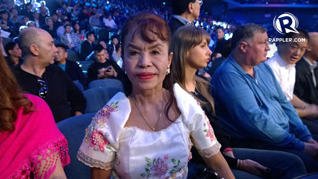 Pacquiao's mother Mommy D sits a row behind Jinkee. She asked about going to the dugout to bless her son.