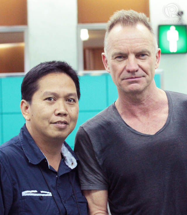 A fan has his photo taken with English musician Sting at Ninoy Aquino International Airport.