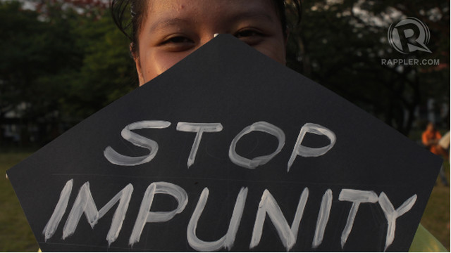 PRESS FREEDOM. A journalism student from Bicol holds a placard that reads "Stop Impunity."