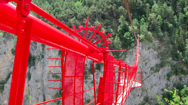DARE TO WALK ACROSS. This suspension bridge is so high up it's terrifying!