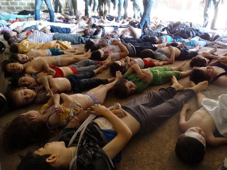 TOXIC GAS? A handout image released by the Syrian opposition's Shaam News Network shows bodies of children and adults laying on the ground as Syrian rebels claim they were killed in a toxic gas attack by pro-government forces in eastern Ghouta, on the outskirts of Damascus on August 21, 2013. AFP/Handout/Shaam News Network