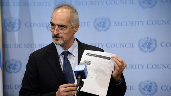 epa03865029 Syrian Ambassador to the United Nations, Bashar Al-Jaafari hold up a document that he says refers to Israel's chemical weapons program speaks at a press conference at United Nations headquarters in New York, New York, USA, 12 September 2013 EPA/ANDREW GOMBERT