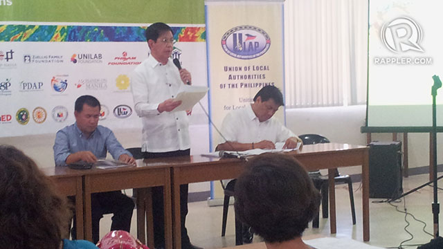 'REBUILD BETTER AND SAFER'. Before responding to questions, former Sen. Panfilo Lacson reads the President's message to the mayors attending a consultation workshop by Tabang Visayas on Tuesday, December 17. Photo by Michael Bueza / Rappler
