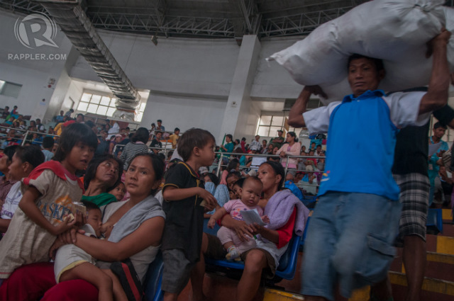 'TRAUMATIZED' SURVIVORS. Typhoon Glenda (Rammasun) forces more than 2,600 Super Typhoon Yolanda (Haiyan) survivors to evacuate again, humanitarian group Oxfam says. Photo by Roy Lagarde/Rappler