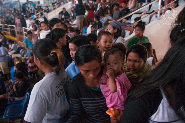 EVACUATING AGAIN. Up to 2,000 homeless Yolanda survivors evacuate in the Tacloban Astrodome alone when Typhoon Glenda (Rammasun) struck the Philippines. Photo by Roy Lagarde/Rappler