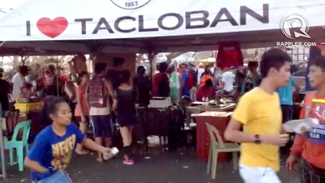 PANIC. Residents and responders scatter as gun shots are heard near the Tacloban command center. Screengrab of video taken by Ruper Ambil/Rappler