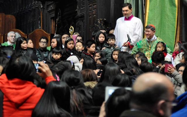 FILIPINOS EVERYWHERE. Filipino children flock to Cardinal Luis Antonio Tagle, the Manila archbishop, after his Mass in Milan in February. Photo by the Philippine Consulate General in Milan